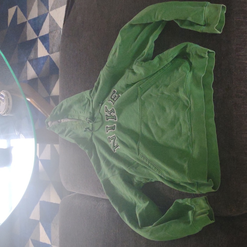 Green Nike women's size medium m sweatshirt used with some yellow spots💚